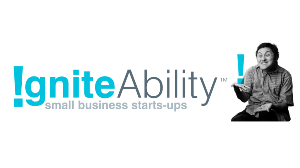 A black and white photo of a guy smiling with the IgniteAbility logo on the left side of the banner