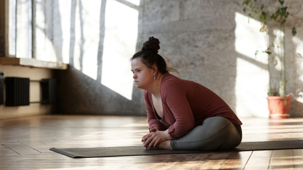 a young lady doing a yoga stretch